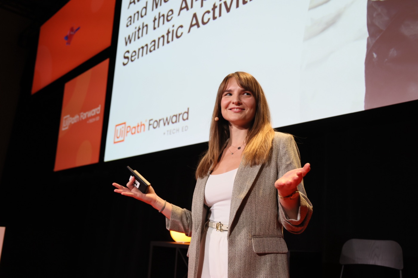 Teodora Baciu speaking on stage at UiPath Forward 2024 in Las Vegas.